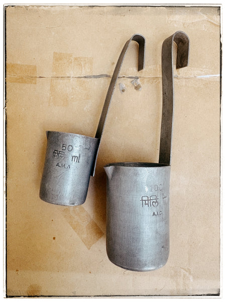 Vintage tin milk measures