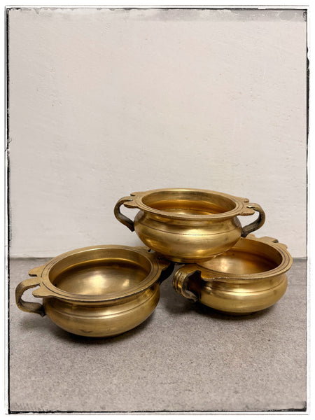 Small brass urli bowls