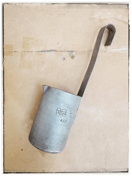 Vintage tin milk measures