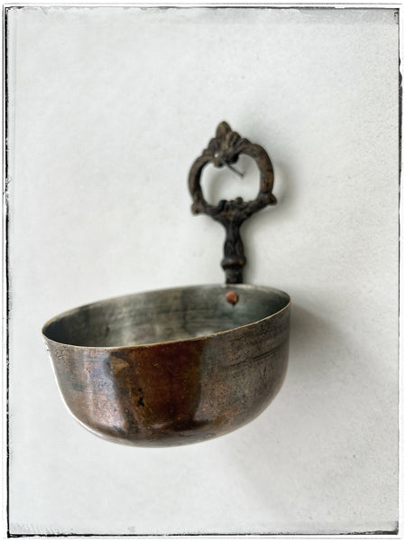 Vintage brass bowl with hook.