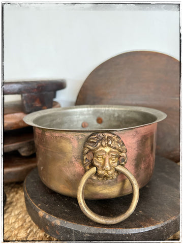 Antique brass pot with lions