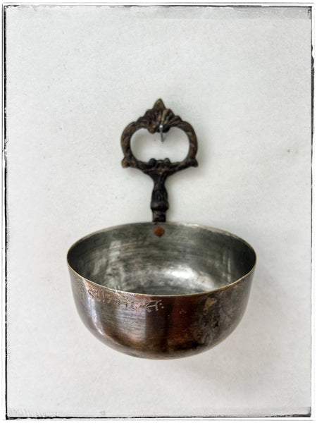 Vintage brass bowl with hook.