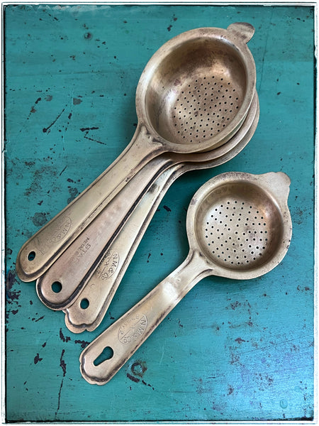 Vintage pressed tea strainers