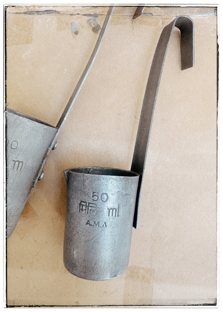 Vintage tin milk measures