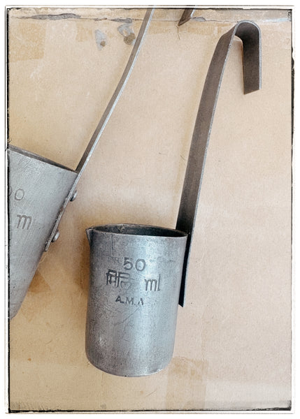 Vintage tin milk measures