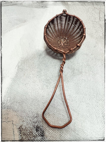Woven copper tea strainer