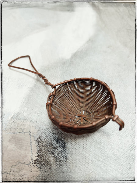 Woven copper tea strainer
