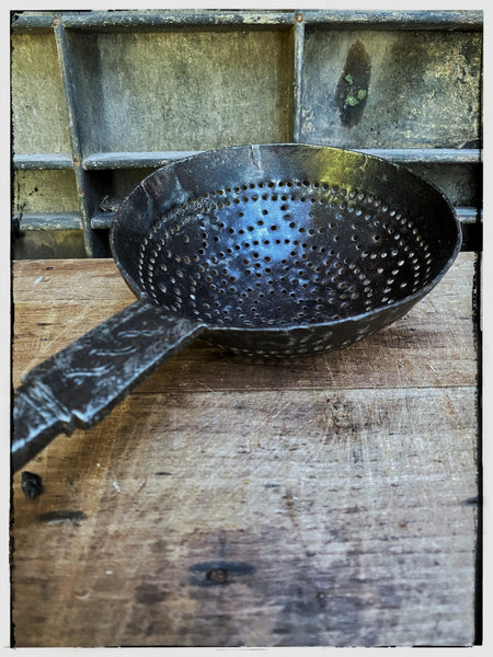 Forged iron strainer