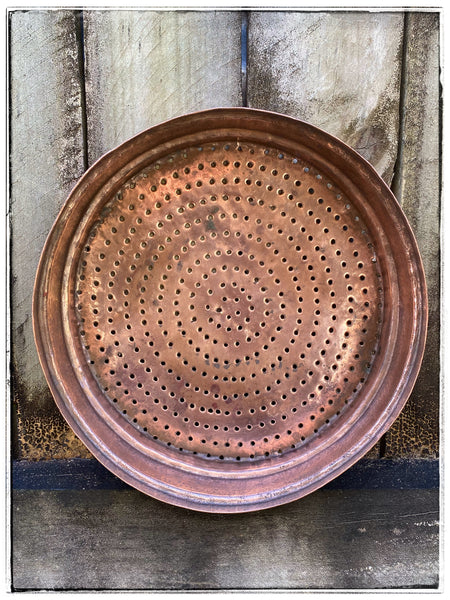 Antique copper sieve
