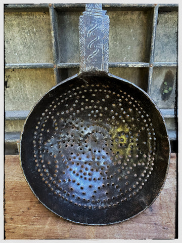 Forged iron strainer