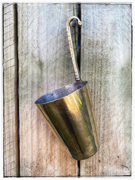 Hanging brass cup